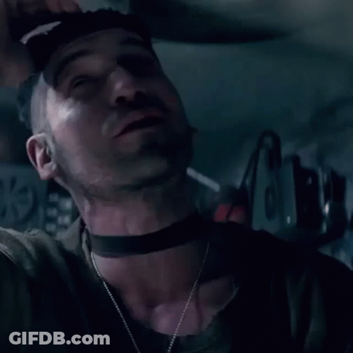 Man Smoking Cigarette In Dark Room GIF
