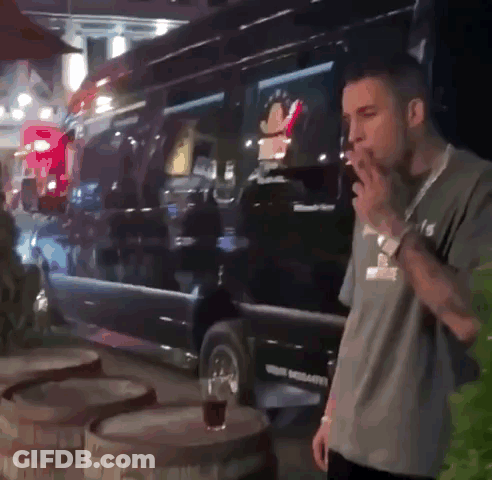 Man Smoking Cigarette In Front Of Texas Van GIF