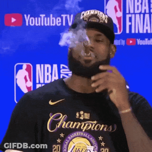 Man Smoking Cigarette In Front Of YouTube TV Sign GIF