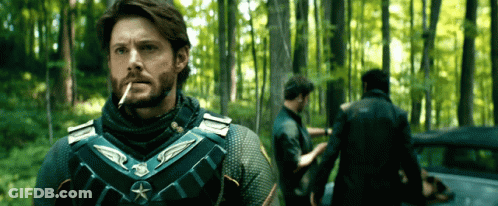 Man Smoking Cigarette In Woods GIF