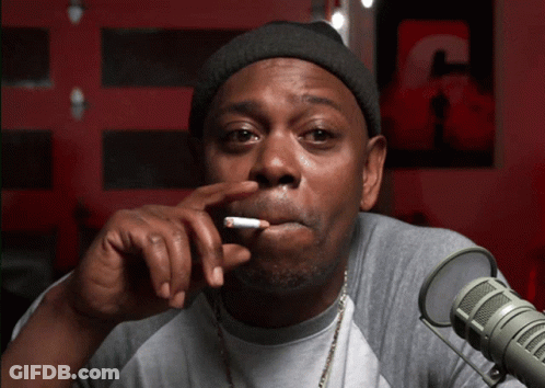 Man Smoking Cigarette Near Microphone With Letter C GIF