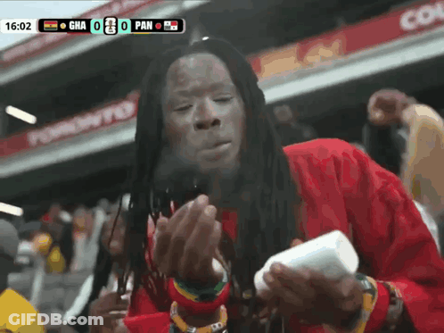 Man Smoking Cigarette Scoreboard Saying Gha 0 Pan GIF