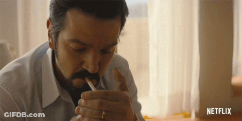 Man Smoking Cigarette With Netflix Logo GIF