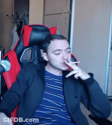 Man Smoking In Red And Black Chair GIF