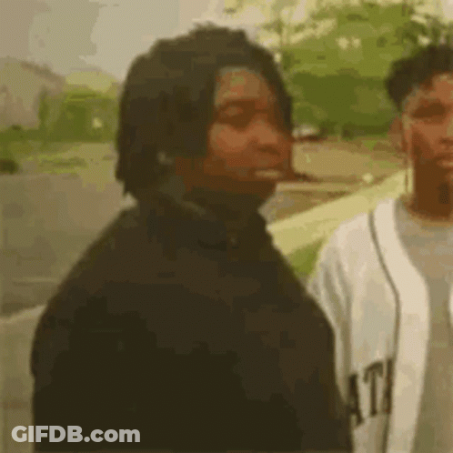 Man Smoking Next To Baseball Player GIF