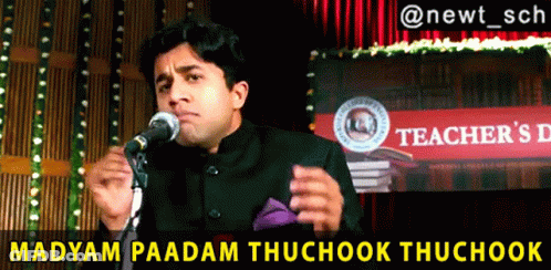 Man Speaking Into Microphone At Teacher's Day Sign GIF