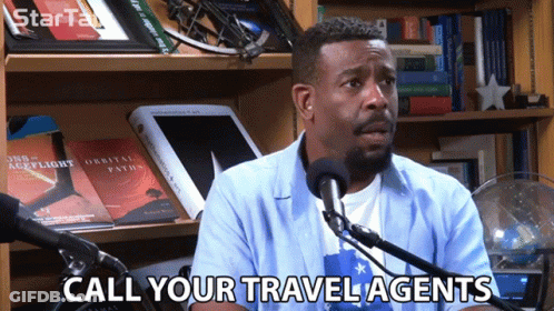 Man Speaking Into Microphone Call Your Travel Agents GIF