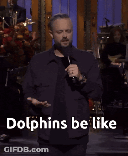 Man Speaking Into Microphone Get My Dolphins Be Like GIF