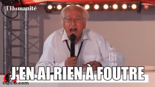Man Speaking Into Microphone Saying J'en Ai Rien A Foutre GIF