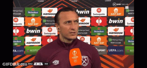 Man Speaking Into Microphone With Bwin And Swissquote GIF