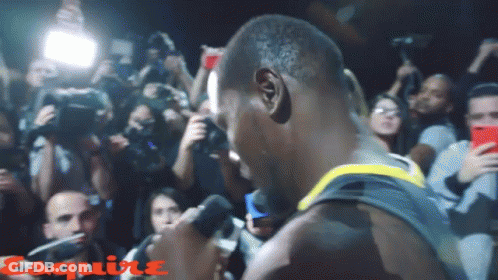 Man Speaking Into Microphone With Esquire GIF