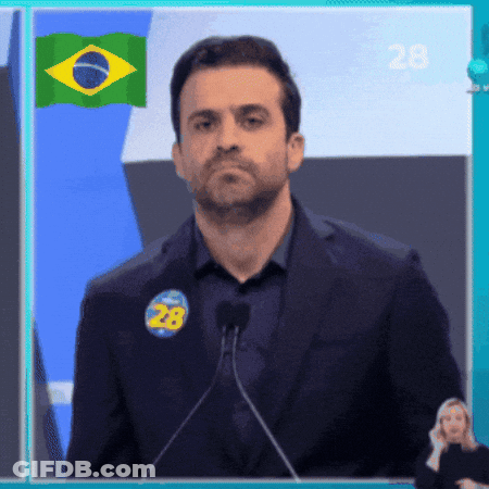Man Speaking Into Microphone With Sticker Saying 28 GIF