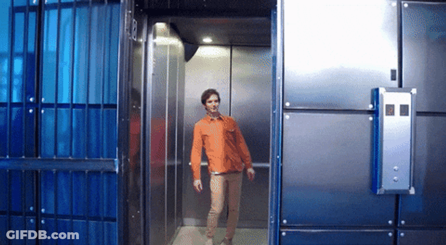 Man Spinning His Hips Inside Elevator GIF