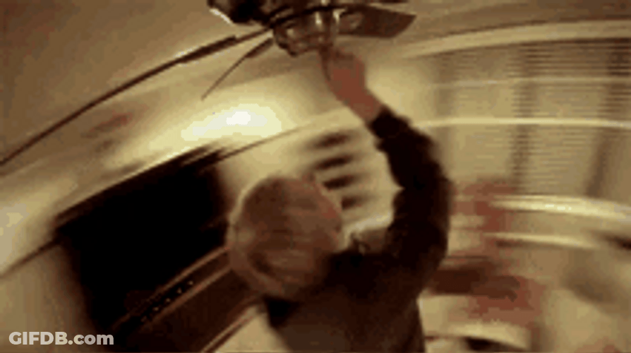Man Spinning With Ceiling Fan GIF