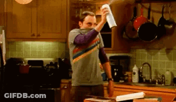 Man Spraying Air Freshener On Kitchen Counter GIF