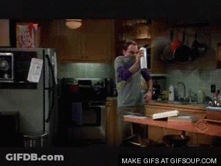 Man Spraying In Kitchen GIF