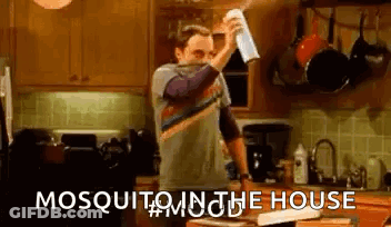 Man Spraying Paper Towel With Mosquito Killer In Kitchen GIF