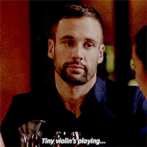 Man Spreading Sarcasm With Worlds Smallest Violin GIF