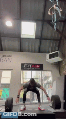 Man Squatting In Front Of Fit Sign GIF