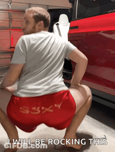 Man Squatting In Front Of Red Car Saying I Will Be Rocking This GIF