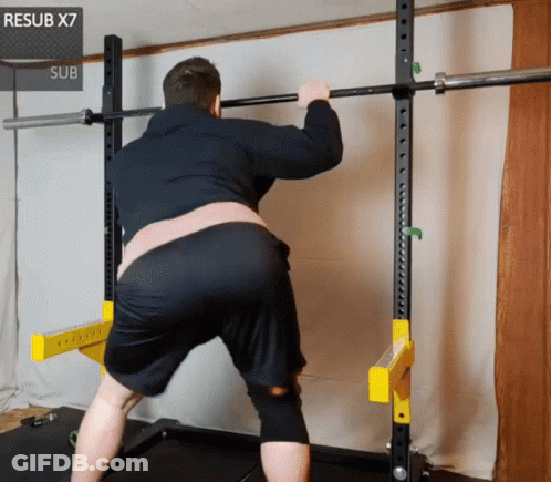 Man Squatting In Front Of Resub X7 Sub Sign GIF