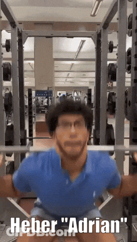 Man Squatting In Gym Saying Heber Adrian GIF