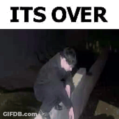 Man Squatting On Couch In Dark Room Saying It's Over GIF