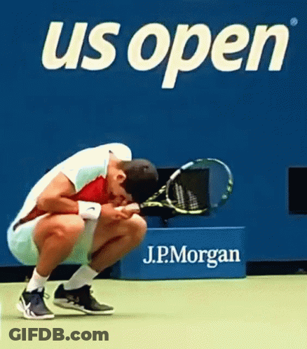 Man Squatting On Tennis Court GIF