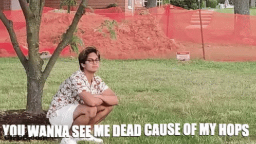 Man Squatting Under Tree With Funny Caption GIF