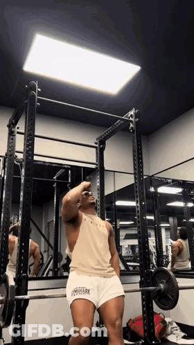 Man Squatting With Barbell In Gym Wearing Longshark Tank Top GIF