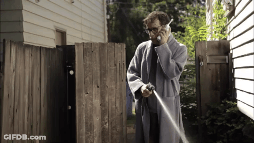 Man Squirt Water Using Fire Hose GIF