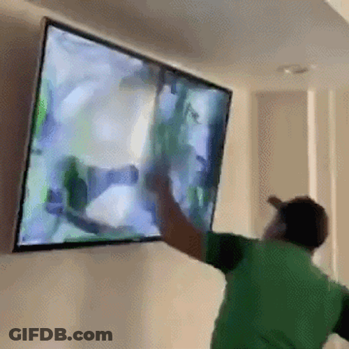 Man Stabbing A Television GIF