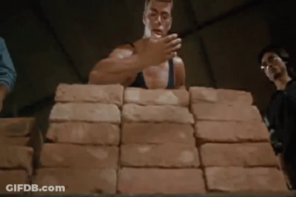 Man Stacking Bricks GIF