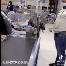 Man Standing At Checkout Counter GIF