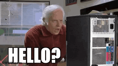 Man Standing At Computer Says Hello? GIF