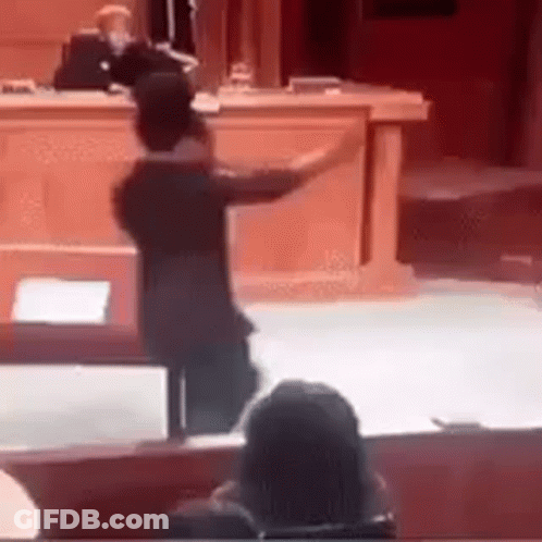 Man Standing At Podium In Courtroom GIF