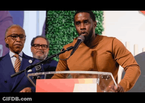 Man Standing At Podium With Microphone GIF