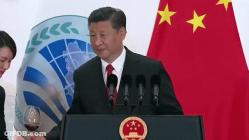 Man Standing At Podium With Wine GIF