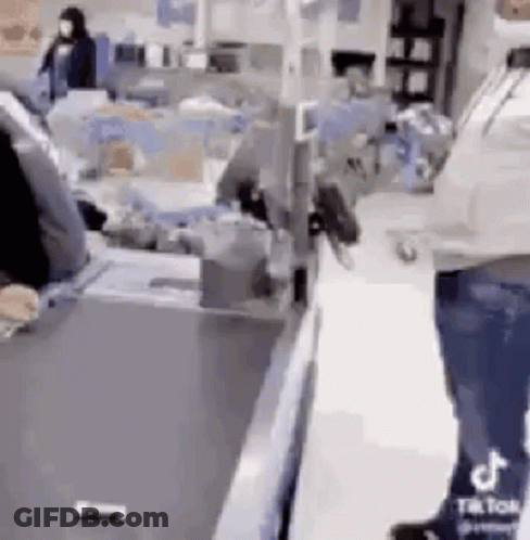 Man Standing At Store Counter GIF