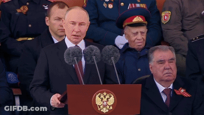 Man Standing At Ura Podium GIF