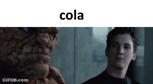 Man Standing Before Cola Statue GIF