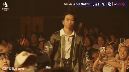 Man Standing Before Crowd With Asahi GIF