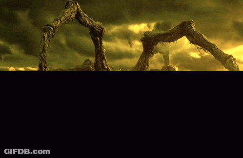 Man Standing Before Giant Spider GIF