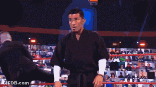 Man Standing Before Img Wrestl Sign GIF