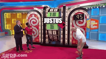 Man Standing Before Justus Game Board GIF