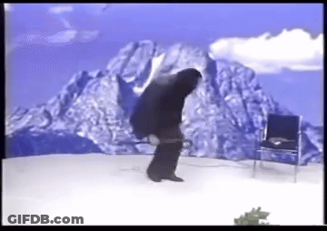 Man Standing Before Mountain And Chair GIF