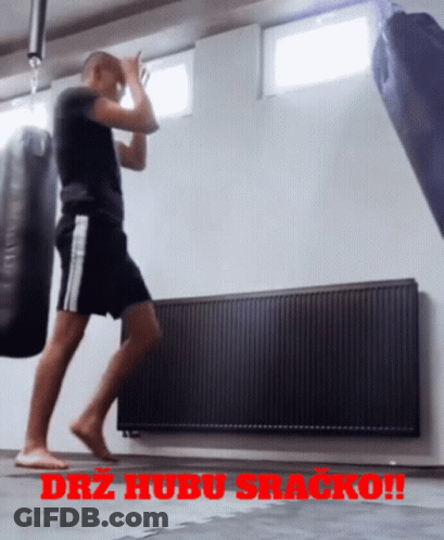 Man Standing Before Punching Bag With Drz Hubu Sracko GIF