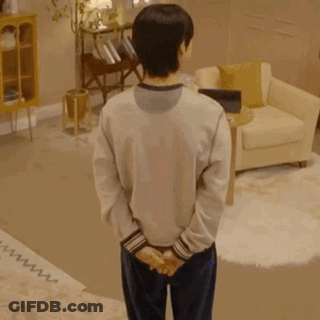 Man Standing Before Skull Crowd GIF
