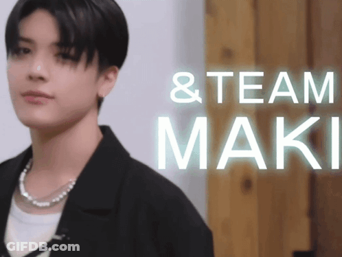 Man Standing Before Team Maki Sign GIF
