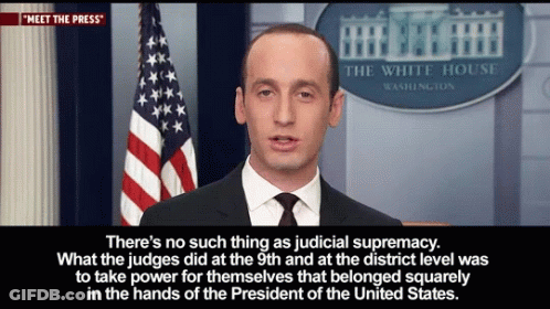 Man Standing Before White House Sign GIF